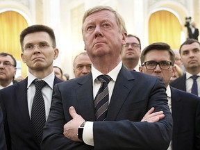 FILE - Rosnano Chairman Anatoly Chubais, center, attends the inauguration of Russian President Vladimir Putin in the Kremlin's Grand Kremlin Palace in Moscow, Russia, Monday, May 7, 2018. Chubais, who resigned as a high-ranking adviser to Russian President Vladimir Putin and left Russia shortly after the invasion of Ukraine, was reported to be in intensive care in a European hospital for a neurological disorder, a Russian television personality and family friend of Chubais, said Sunday, July 31, 2022.