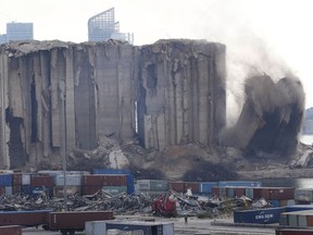 A left part of the silos damaged during the August 2020 massive explosion in the port is seen collapsing, in Beirut, Lebanon,in Beirut, Lebanon, Thursday, Aug. 4, 2022.