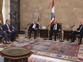 In this photo released by Lebanon's official government photographer Dalati Nohra, U.S. Envoy for Energy Affairs Amos Hochstein, second left, sits next to U.S. Ambassador to Lebanon Dorothy Shea, first left, as they meet with Lebanese Parliament Speaker Nabih Berri, third left, Lebanese president Michel Aoun, center, and Lebanese Prime Minister-designate Najib Mikati, right, at the presidential palace, in Baabda, east of Beirut, Lebanon, Monday, Aug. 1, 2022. Hochstein, a U.S. envoy mediating between Lebanon and Israel over a maritime border dispute between the two countries, said after meeting Lebanese leaders on Monday that he remains optimistic that continuous progress can be made.