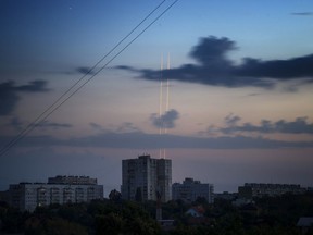 Russian rockets launch against Ukraine from Russia's Belgorod region are seen at dawn in Kharkiv, Ukraine, early Thursday, Aug. 18, 2022.