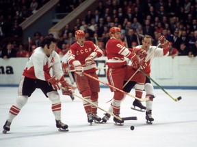 Phil Esposito in action vs the Soviet Union's Yuri Blinov and Boris Mikhailov at Luzhniki Ice Palace for Game 5 of the 1972 Summit Series.