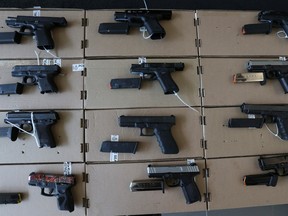 In this August photo, York Regional Police show off seized illegal guns that came to Canada from the U.S. via Walpole Islands First Nations territory.