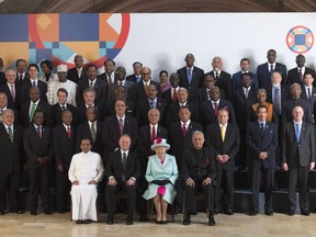 Queen Elizabeth poses with leaders for a family photo at the Commonwealths Heads of Government meeting, Friday Nov. 27, 2015 in Valletta, Malta.