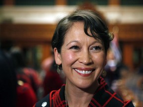 Melanie Mark speaks to the media after becoming the first First Nations woman to serve in the B.C. legislature, at a swearing-in ceremony on Wednesday, Feb. 17, 2016. Mark has resigned her ministerial portfolios to go on medical leave.