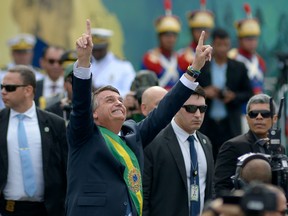 President of Brazil Jair Bolsonaro gestures at the crowd during a parade to celebrate Brazil's 200 Independence anniversary on September 07, 2022 in Brasilia, Brazil. (Photo by Andressa Anholete/Getty Images)