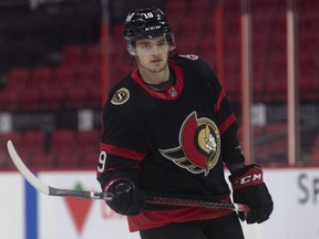 Ottawa Senators right wing Drake Batherson watches a play during warm-up prior to an NHL game against the Toronto Maple Leafs, in Ottawa, Saturday, Jan. 16, 2021. Batherson says he is co-operating with investigations into allegations of sexual assault involving players from the 2018 Canadian world junior team.