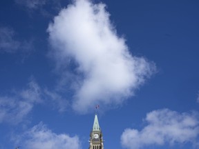 Clouds pass over Parliament Hill and the Peace Tower, Thursday, Sept. 1, 2022 in Ottawa.The Canadian government is making changes to the questionnaire prospective judges must fill out before applying for a federal judicial appointment.&ampnbsp;THE CANADIAN PRESS/Adrian Wyld