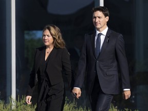 Canadian Prime Minister Justin Trudeau and his wife Sophie Gregoire make their way to a government plane as they depart the airport in Ottawa, Friday, Sept. 16, 2022. Trudeau will travel to New York next week to attend the 77th Session of the United Nations General Assembly.
