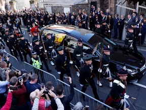 King Charles III joins the procession accompanying Her Majesty The Queen's coffin from the Palace of Holyroodhouse along the Royal Mile to St. Giles Cathedral.