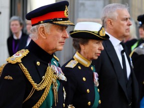 Britain's King Charles, Princess Anne, Prince Andrew and Prince Edward follow the hearse carrying the coffin of Britain's Queen Elizabeth in Edinburgh, Scotland, Britain September 12, 2022.