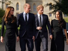 (L-R) Britain's Catherine, Princess of Wales, Britain's Prince William, Prince of Wales, Britain's Prince Harry, Duke of Sussex, and Meghan, Duchess of Sussex on the long Walk at Windsor Castle on September 10, 2022, before meeting well-wishers.