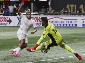 Atlanta United forward Josef Martinez has his shot blocked by Toronto FC goalkeeper Quentin Westberg during the second half of an MLS soccer match Wednesday, Aug. 18, 2021, in Atlanta.