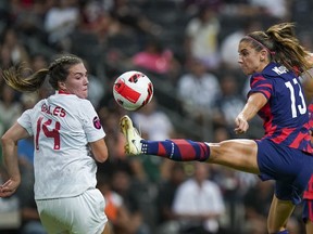 United States' Alex Morgan, right, controls the ball against Canadian defender Vanessa Gilles during the CONCACAF Women's Championship final soccer match in Monterrey, Mexico, Monday, July 18, 2022. Gilles has joined French powerhouse Lyon on loan from the NWSL's Angel City FC.