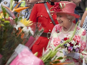 Queen Elizabeth II greets the crowd gathered outside Queen's Park in Toronto on Tuesday July 6, 2010 as she ends her nine-day visit to Canada before flying to New York to address the United Nations