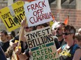 Anti-Fracking protesters demonstrate outside Lancashire County Hall in Preston, England, in 2015.