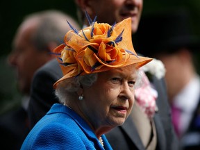 (FILES) In this file photo taken on June 16, 2016 Britain's Queen Elizabeth II looks on during the presentation ceremony for the Gold Cup during Ladies' day at Royal Ascot horse racing meet in Ascot, west of London. - (Photo by ADRIAN DENNIS/AFP via Getty Images)