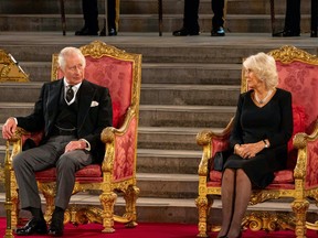 Britain's King Charles and Queen Camilla sit during the presentation of addresses by both Houses of Parliament to his Majesty King Charles III, in Westminster Hall, inside the Palace of Westminster, in London, Britain September 12, 2022. UK Parliament/Roger Harris/Handout via REUTERS