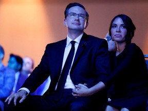 Pierre Poilievre and his wife Anaida Poilievre look on during the Conservative Party leadership election in Ottawa on September 10.