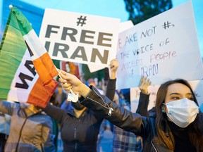 People demonstrate against the Iranian regime during a protest at Mel Lastman Square in Toronto on Sept. 24, 2022.