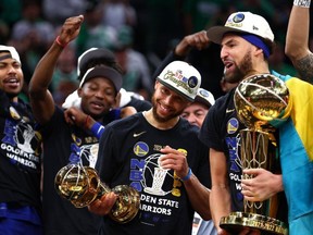 FILE: Stephen Curry #30 and Klay Thompson #11 of the Golden State Warriors celebrate after defeating the Boston Celtics 103-90 in Game Six of the 2022 NBA Finals at TD Garden on June 16, 2022 in Boston, Mass. /