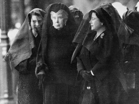 From left, then-princess Elizabeth, Queen Mary and Queen Elizabeth are photographed at London King's Cross railway station, waiting for the arrival of the special train bringing the coffin of King George VI from Sandringham, on Feb. 11, 1952.