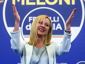 Giorgia Meloni, leader of the Fratelli d'Italia (Brothers of Italy) gestures during a press conference at the party electoral headquarters overnight, on September 25, 2022 in Rome, Italy.