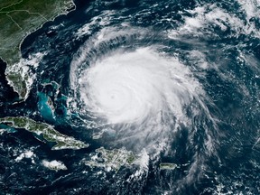 RAMMB National Oceanic and Atmospheric Administration (NOAA) satellite image shows Hurricane Fiona over Puerto Rico on September 21, 2022. It is churning toward Atlantic Canada, Environment Canada says.