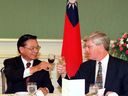 Canada's Industry Minister John Manley meets with Taiwan's Council for Economic Planning and Development Chairman Chiang Pin-kung in Taipei, September 10, 1998. “It was a different era both politically and economically,” Manley now says regarding the lack of “major pushback” from China at the time over his three day visit to Taiwan.