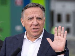 Coalition Avenir du Quebec leader Francois Legault speaks to the media while campaigning Wednesday, August 31, 2022 in Montreal. Quebec votes in the provincial election Oct. 3.