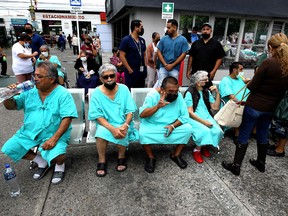 Patients in treatment wait in the esplanade of a medical center moments after an earthquake in Guadalajara, Jalisco state, Mexico, on September 19, 2022.