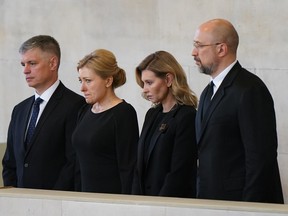 Ukrainian Ambassador to the UK, Vadym Prystaiko (left) and the First Lady of Ukraine, Olena Zelenska (second right) view the coffin of Queen Elizabeth II lying in state at Westminster Hall on September 18, 2022 in London, England.