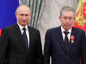 Russian President Vladimir Putin and Lukoil Vice-President Ravil Maganov in 2019. Maganov was recently reported to have died after falling from a hospital window.