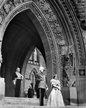 King George VI, Queen Elizabeth and Prime Minister William Lyon Mackenzie King stand under the arches of the Peace Tower in Ottawa. The photo was voted best of the 1939 royal tour by the British Press.