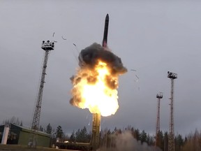 An intercontinental ballistic missile lifts off from a truck-mounted launcher somewhere in Russia.