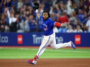 Vladimir Guerrero Jr. of the Toronto Blue Jays celebrates his walk-off RBI single in the 10th inning for a 3-2 win against the New York Yankees at Rogers Centre on September 26, 2022.