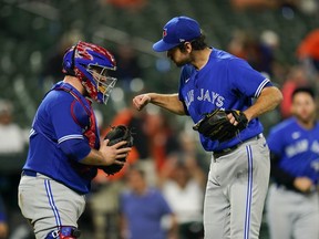 Toronto Blue Jays catcher Alejandro Kirk, left, and relief pitcher Jordan Romano celebrate after defeating the Baltimore Orioles in a baseball game, Wednesday, Sept. 7, 2022, in Baltimore. The Blue Jays won 4-1.