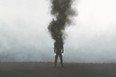 Illustration of man vanishing in a dark black smoke, surreal emotional concept