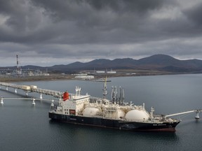 FILE - The tanker Sun Arrows loads its cargo of liquefied natural gas from the Sakhalin-2 project in the port of Prigorodnoye, Russia, on Friday, Oct. 29, 2021. A new report says Russia sent significantly more oil and coal to India and China over the summer compared with the start of the year, while European countries that long relied on Russian energy have cut back sharply in response to the conflict in Ukraine. The Centre for Research on Energy and Clean Air said Tuesday, Sept. 6, 2022 that Russia received about 158 billion euros in revenue for the sale of oil, natural gas and coal from February to August. (AP Photo, File)