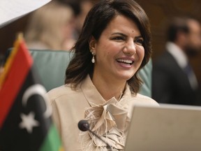Libyan Foreign Minister Najla Mangoush smiles as she chairs the Arab League foreign ministers annual meeting in Cairo, Egypt, Tuesday, Sept. 6, 2022.