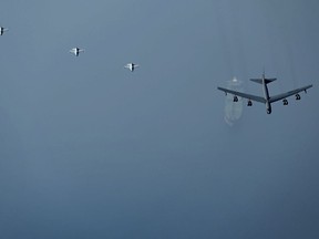This photo released by the U.S. Air Force shows a B-52H Stratofortress assigned to the 5th Bomb Wing, Minot Air Force Base, North Dakota, flying over an oil tanker in the Middle East on Sunday, Sept. 4, 2022. The United States military said Monday it flew a pair of nuclear-capable B-52 long-distance bombers over the Middle East in a show of force, the latest such mission in the region as tensions remain high between Washington and Tehran.