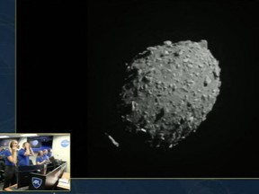 A NASA team watches the asteroid Dimorphos seconds before the Double Asteroid Redirection Test (DART) spacecraft crashes into it, in a screengrab made from NASA live feed on September 26, 2022.
