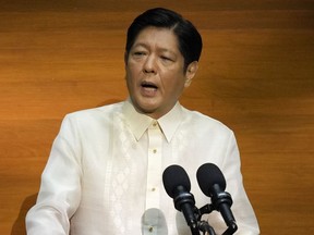 FILE - Philippine President Ferdinand Marcos Jr. delivers his first state of the nation address in, Quezon city, Philippines, Monday, July 25, 2022. Human rights activists in the Philippines rejected on Saturday, Sept. 10, 2022, Marcos Jr.'s move to proclaim the birthday of his late father, an ousted dictator, a special holiday in their northern home province.