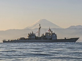Ticonderoga-class guided-missile cruiser USS Antietam (CG 54) is underway off the coast of Japan near Mt. Fuji. Antietam is on patrol in the 7th Fleet area of operations in support of security and stability in the Indo-Asia-Pacific region, Nov. 22, 2014. The U.S. Navy is sailing the USS Antietam and the USS Chancellorsville warships through the Taiwan Strait Sunday, in the first such transit publicized since US House Speaker Nancy Pelosi visited Taiwan earlier in August, at a time where tensions have kept the waterway particularly busy.