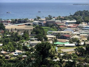 FILE - Ships are docked offshore in Honiara, the capital of the Solomon Islands, Nov. 24, 2018. Lawmakers in the Solomon Islands voted Thursday, Sept. 8, 2022, to delay their nation's general election from next year until 2024, a move that opponents say amounts to a power grab and that some fear could lead to further civil unrest.
