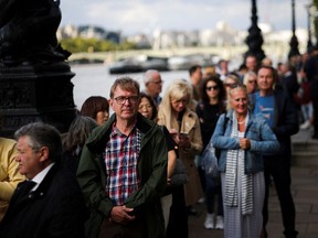 People stand in a queue to pay respect to Britain's Queen Elizabeth, following her death, in London, Britain Sept. 15.
