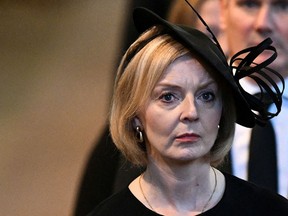 Britain's Prime Minister Liz Truss leaves after a service for the reception of Queen Elizabeth II's coffin at Westminster Hall.