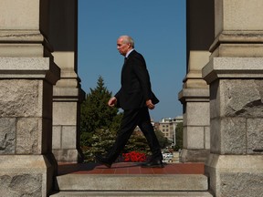 Premier John Horgan makes his way back to his office after his visit to the Hall of Honour to sign a book of condolence for Queen Elizabeth II while at the legislature in Victoria, B.C., on Monday, September 12, 2022. Dignitaries including the premier and Lt.-Gov. Janet Austin have joined a commemorative service in honour of Queen Elizabeth II in the capital city named after her great-great-grandmother.THE CANADIAN PRESS/Chad Hipolito