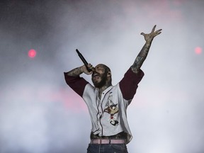 FILE - American rapper Post Malone performs during the Rock in Rio music festival in Rio de Janeiro, Brazil, Sept. 4, 2022. Malone went to the hospital on Saturday Sept. 24, 2022, after experiencing what he described on social media as difficulty breathing and stabbing pain, forcing him to postpone a scheduled show in Boston. He also spent time in the hospital last weekend after falling into a hole on stage at the Enterprise Center in St. Louis last weekend.