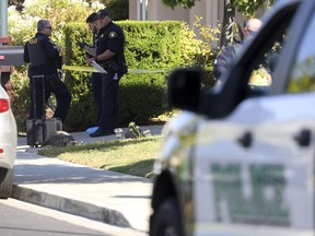 Police officers work the scene of a double homicide at a home on Wednesday, Sept. 7, 2022, in Dublin, Calif. Devin Willams Jr., an Alameda County Deputy Sheriff, is accused in the double-slaying.