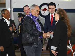 East Timor's President Jose Ramos-Horta, center, is met by Lismore MP Jangle Saffin after arriving at Fairbairn Airport in Canberra, Australia, Tuesday, Sept. 6, 2022. Ramos-Horta is in Australia on a five day official visit to Australia.